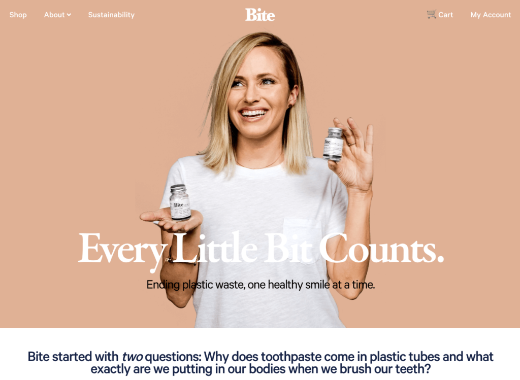From Bite's About Us page, CEO & Co-Founder Lindsay McCormick smiling while holding a branded glass vial of Bite toothpaste bits
