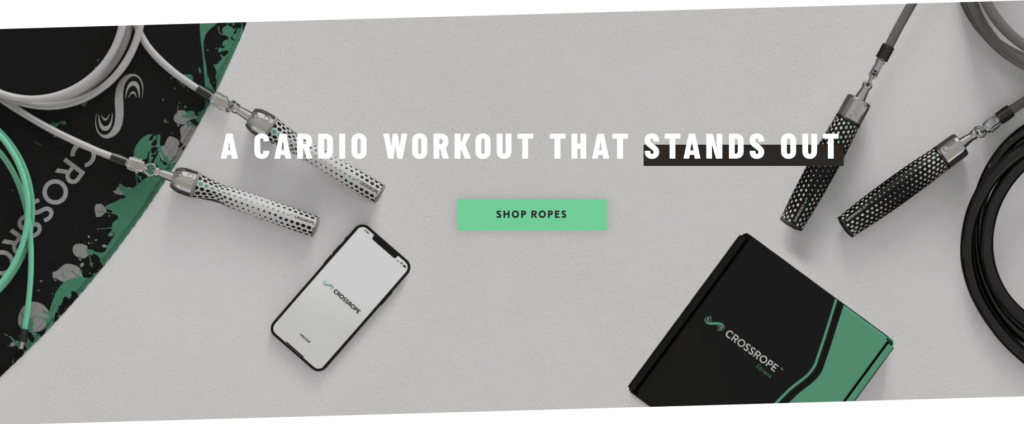 A topdown shot of crossropes weighted jumping rope as well as a branded logo and their app on a smartphone